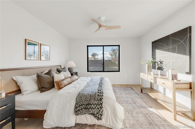 bedroom featuring hardwood / wood-style floors and ceiling fan