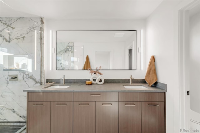 bathroom featuring vanity and a shower