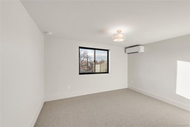 carpeted spare room featuring a wall mounted air conditioner