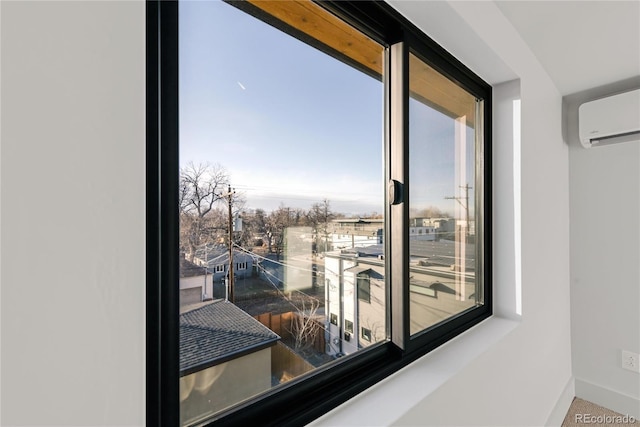 interior details with a wall mounted AC