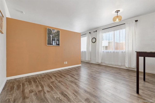 spare room with hardwood / wood-style floors