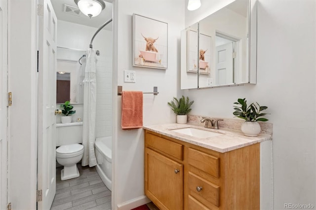 full bathroom with shower / bath combo with shower curtain, vanity, and toilet