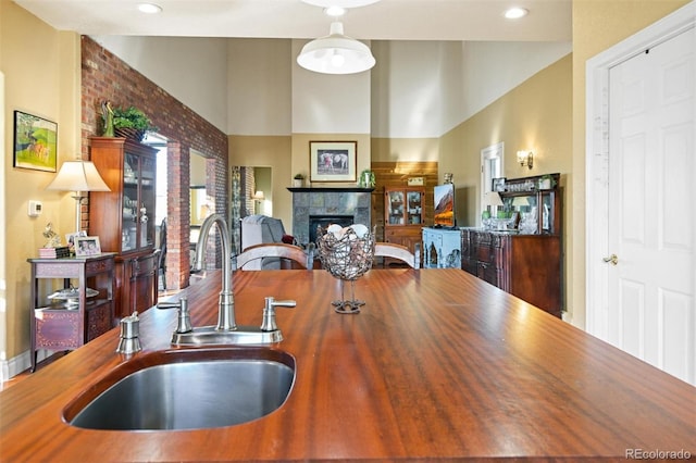 dining area with sink and a fireplace