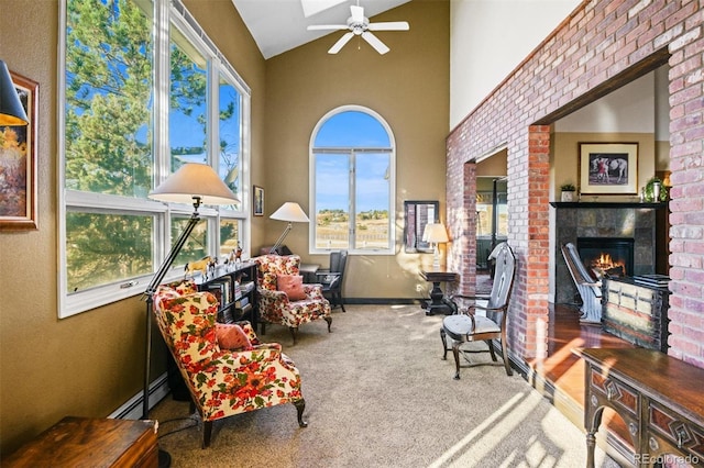 sunroom / solarium featuring ceiling fan, vaulted ceiling, and a baseboard heating unit