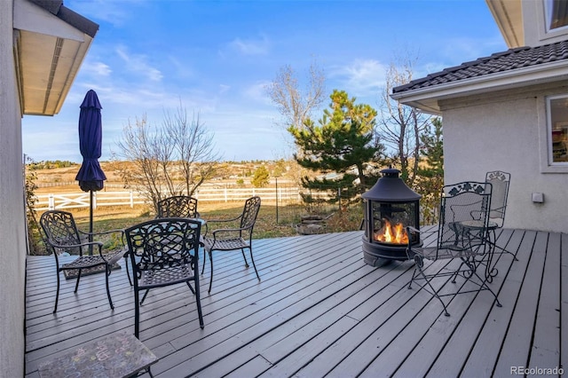 wooden deck with an outdoor fire pit