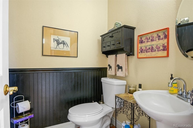 bathroom with toilet and sink