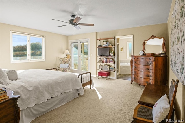 carpeted bedroom with french doors, ensuite bath, access to exterior, and ceiling fan