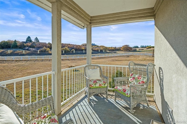 balcony featuring a rural view