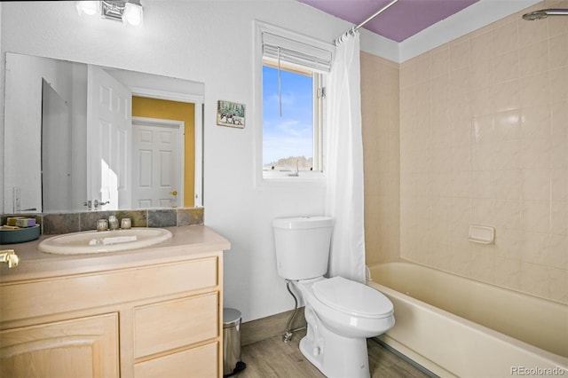 full bathroom with vanity, wood-type flooring, toilet, and shower / tub combo with curtain