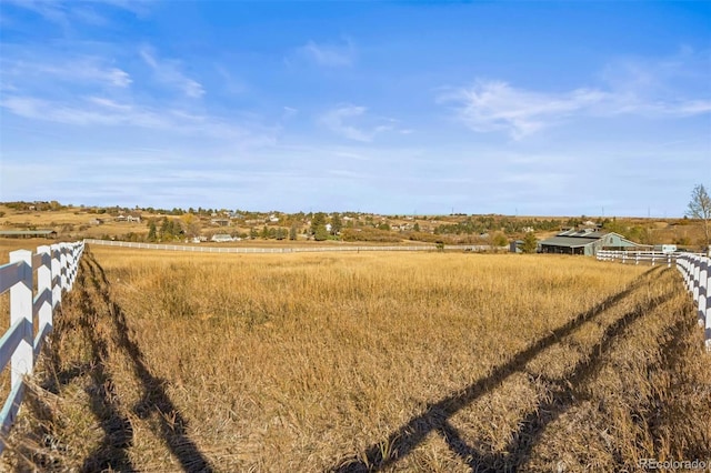 view of yard with a rural view