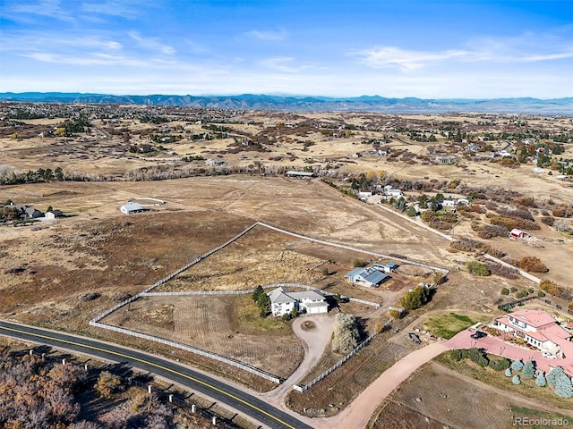 birds eye view of property featuring a mountain view