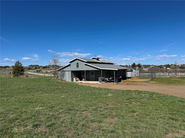 595 W Oak Hill Ln, Castle Rock, CO 80108 - rear view of house featuring a pole building and an outbuilding