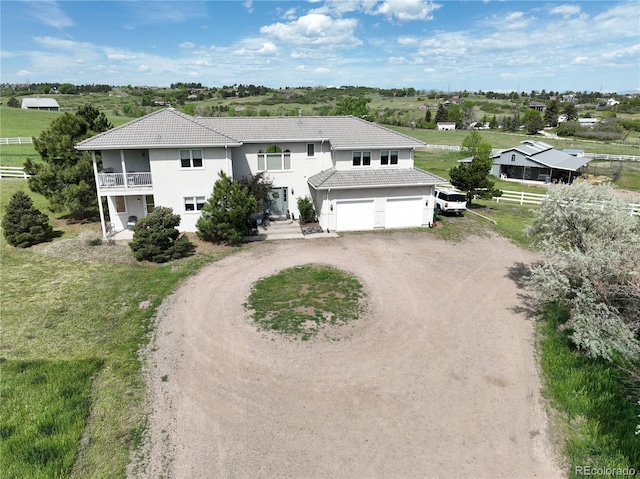 595 W Oak Hill Ln, Castle Rock, CO 80108 - view of front of home featuring driveway, a tile roof, an attached garage, and a balcony