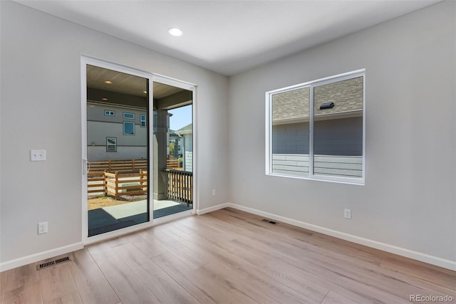 spare room with light wood-type flooring