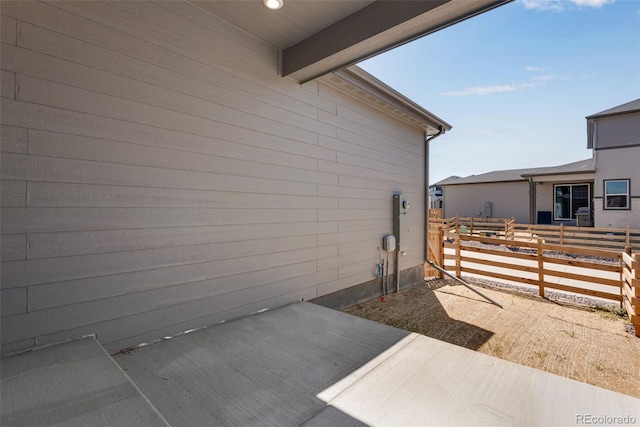 view of side of home featuring a patio area