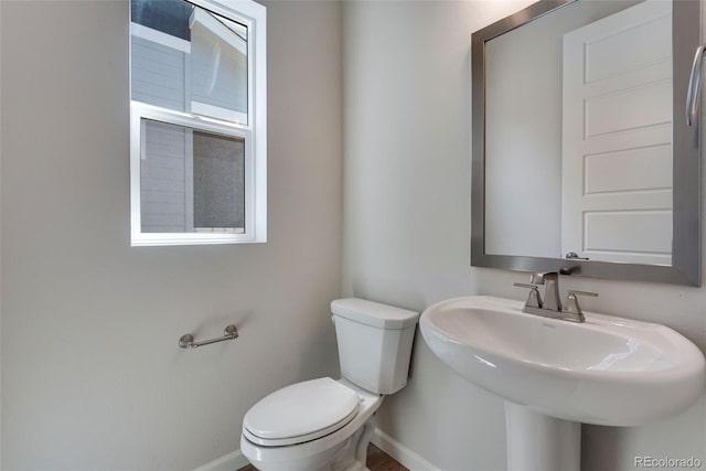 bathroom with toilet and sink