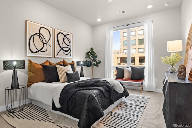 bedroom featuring recessed lighting, visible vents, baseboards, and light colored carpet