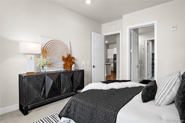 bedroom with visible vents, baseboards, carpet, recessed lighting, and stainless steel fridge