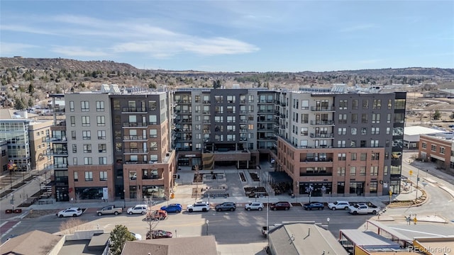 view of property featuring uncovered parking