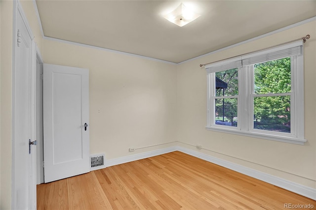 1208 S Elizabeth St, Denver, CO 80210 - spare room featuring light wood-style flooring and baseboards