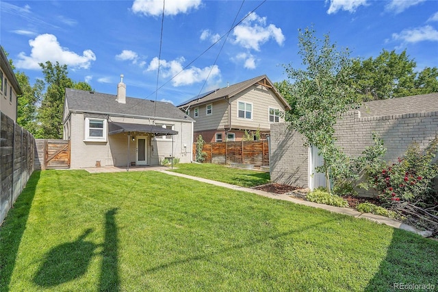 1208 S Elizabeth St, Denver, CO 80210 - rear view of house with a chimney and brick siding