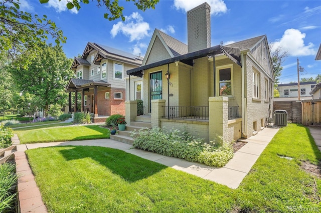 1208 S Elizabeth St, Denver, CO 80210 - view of front of house featuring brick siding, a chimney, a porch, and central AC unit
