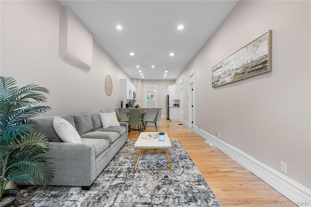 328 E Dakota Ave, Denver, CO 80209 - living room featuring recessed lighting, light wood-style flooring, and baseboards