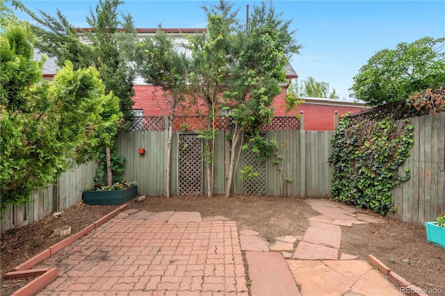 328 E Dakota Ave, Denver, CO 80209 - fenced backyard featuring a patio area