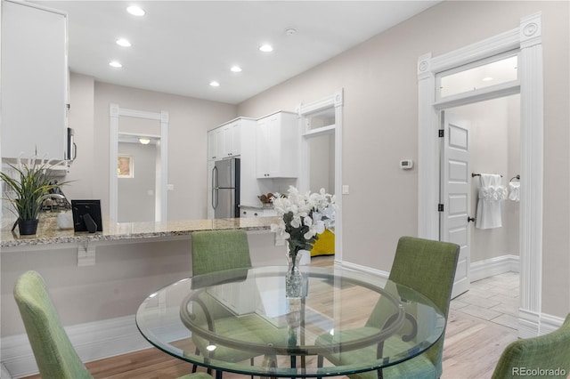 328 E Dakota Ave, Denver, CO 80209 - dining area with recessed lighting, light wood-style flooring, and baseboards