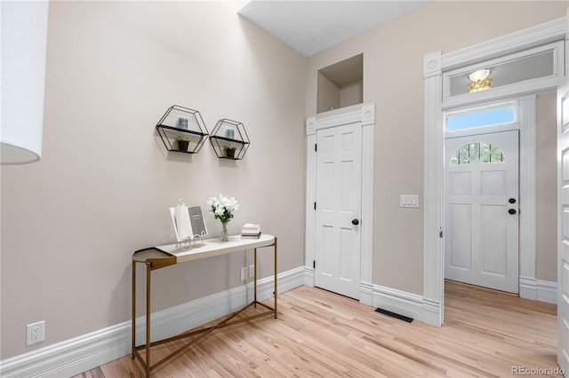 328 E Dakota Ave, Denver, CO 80209 - foyer entrance featuring light wood-type flooring