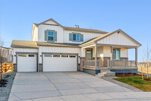 view of front of property featuring a garage and covered porch