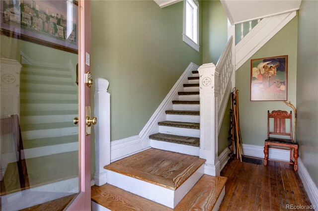 2358 N Ogden St Unit B, Denver, CO 80205 - stairway with hardwood / wood-style floors and baseboards