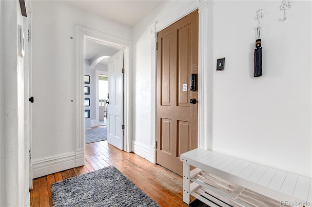 2358 N Ogden St Unit B, Denver, CO 80205 - foyer entrance with arched walkways and light wood-type flooring