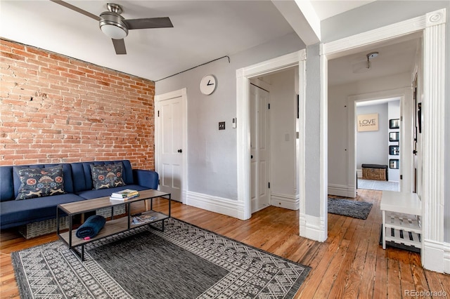 2358 N Ogden St Unit B, Denver, CO 80205 - living room featuring ceiling fan, brick wall, and hardwood / wood-style flooring