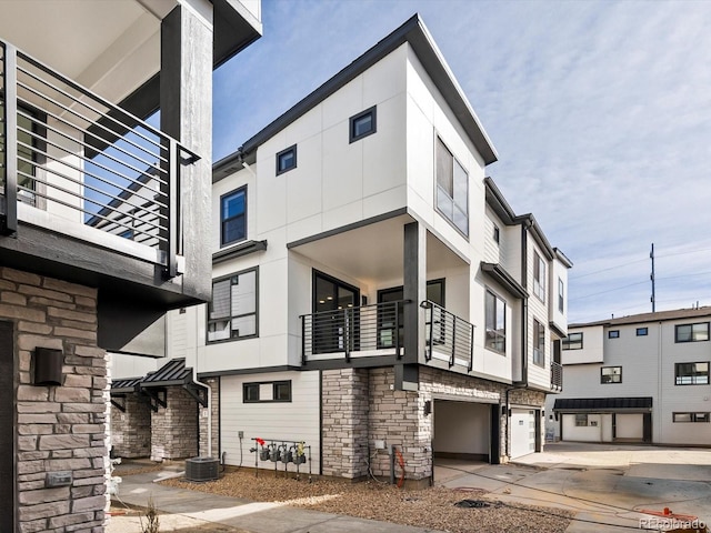 2050 S Holly St Unit 1, Denver, CO 80222 - view of building exterior featuring a garage
