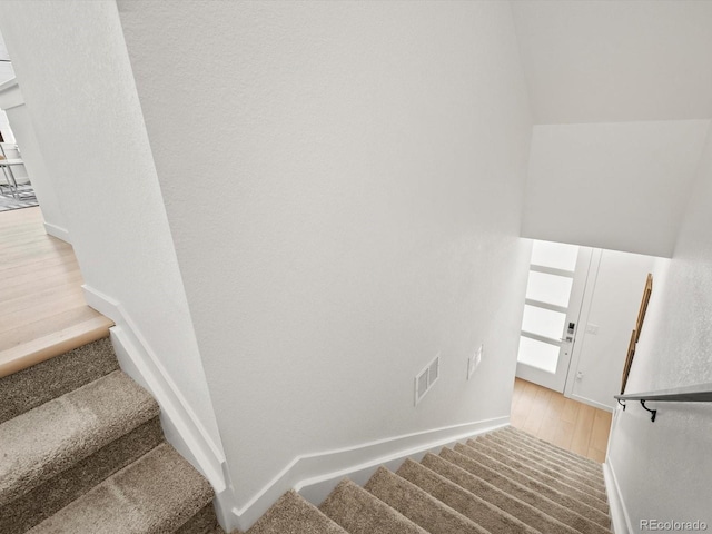 2050 S Holly St Unit 1, Denver, CO 80222 - stairs with baseboards and wood finished floors