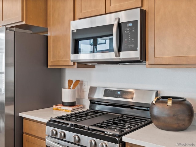 2050 S Holly St Unit 1, Denver, CO 80222 - kitchen with stainless steel appliances and light countertops