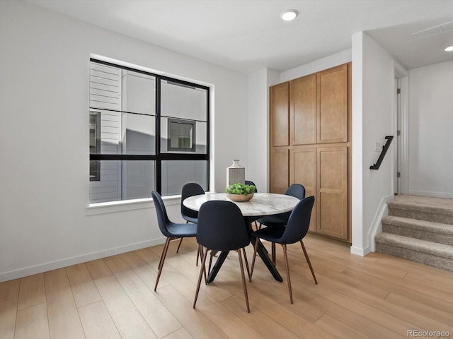 2050 S Holly St Unit 1, Denver, CO 80222 - dining area with light wood-style floors, stairs, and recessed lighting