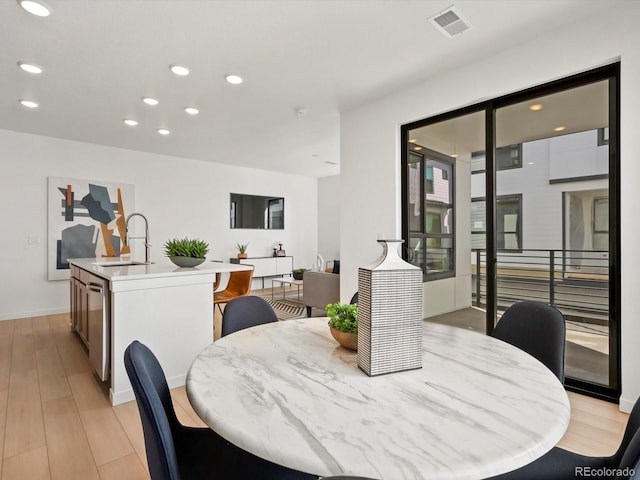 2050 S Holly St Unit 1, Denver, CO 80222 - dining space with recessed lighting and light wood-type flooring