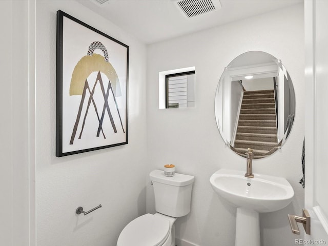 2050 S Holly St Unit 1, Denver, CO 80222 - half bathroom featuring toilet and a sink