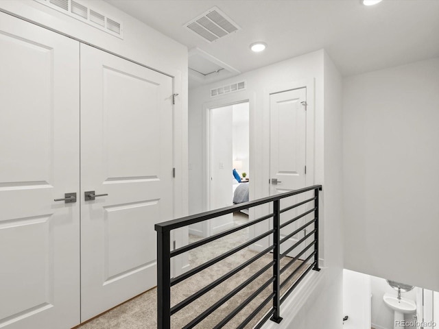 2050 S Holly St Unit 1, Denver, CO 80222 - hallway with an upstairs landing and recessed lighting