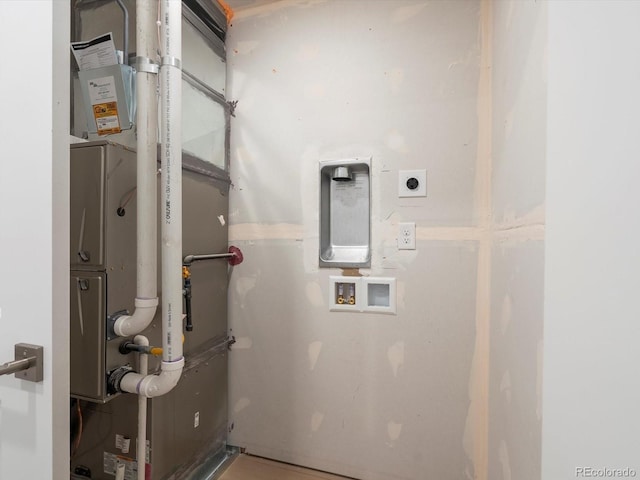 2050 S Holly St Unit 1, Denver, CO 80222 - utility room with heating unit