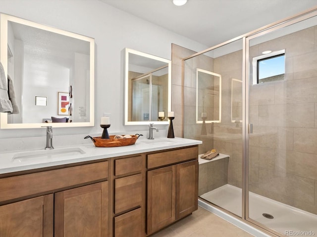 2050 S Holly St Unit 1, Denver, CO 80222 - bathroom featuring a shower stall, double vanity, and tile patterned flooring