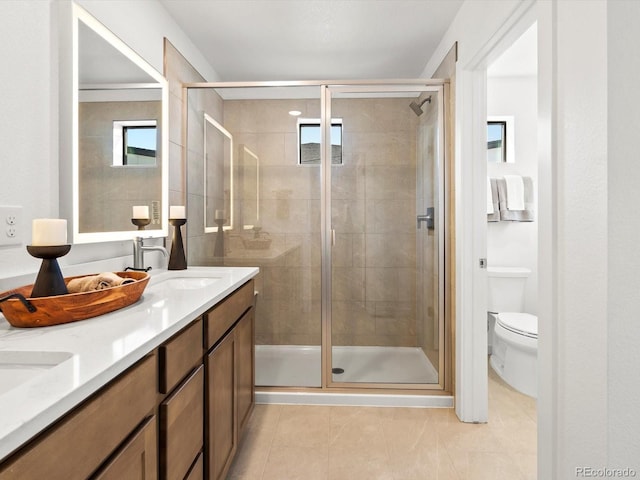 2050 S Holly St Unit 1, Denver, CO 80222 - bathroom featuring tile patterned flooring, double vanity, and a shower stall
