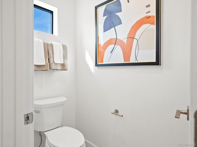 2050 S Holly St Unit 1, Denver, CO 80222 - bathroom with toilet and baseboards