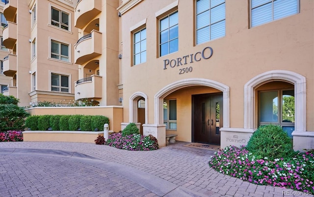 property entrance with stucco siding