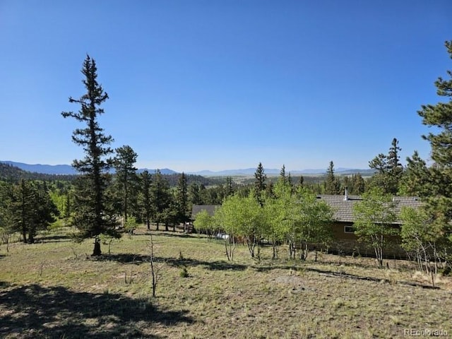 property view of mountains featuring a rural view