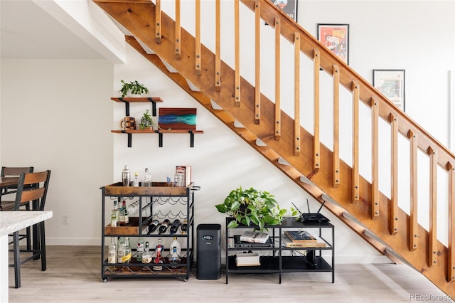 3026 W Prentice Ave Unit H, Littleton, CO 80123 - staircase featuring wood finished floors and baseboards