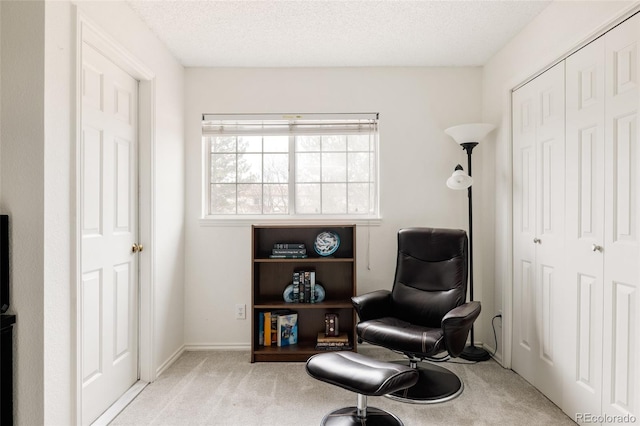 3026 W Prentice Ave Unit H, Littleton, CO 80123 - sitting room featuring carpet flooring and a textured ceiling