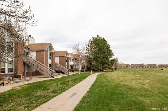 3026 W Prentice Ave Unit H, Littleton, CO 80123 - surrounding community with a lawn and stairway